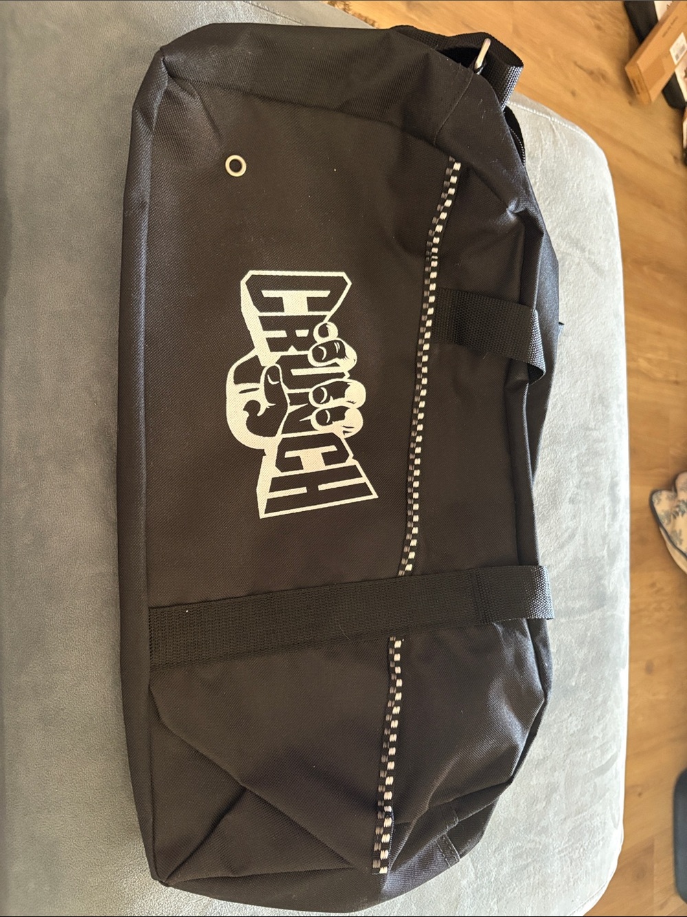Unlisted Black Duffel Bag with White Logo